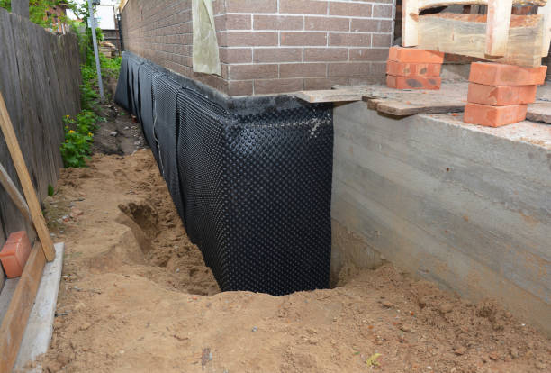 SJ Waterproofing Pros technician performing targeted Wet Basement Repair assessment in Albion, PA